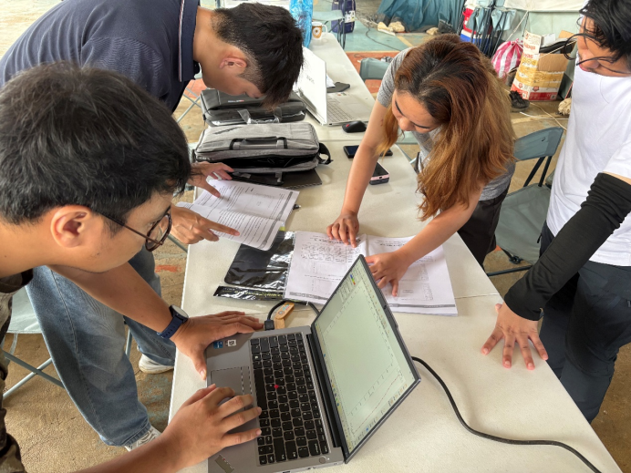 Collaborative technical discussion as our engineer reviews the operating manual while the customer analyzes radar data and consults the user documentation together..png